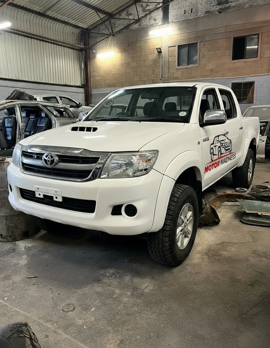A Motor Madness-branded Toyota Hilux inside the Msasa workshop