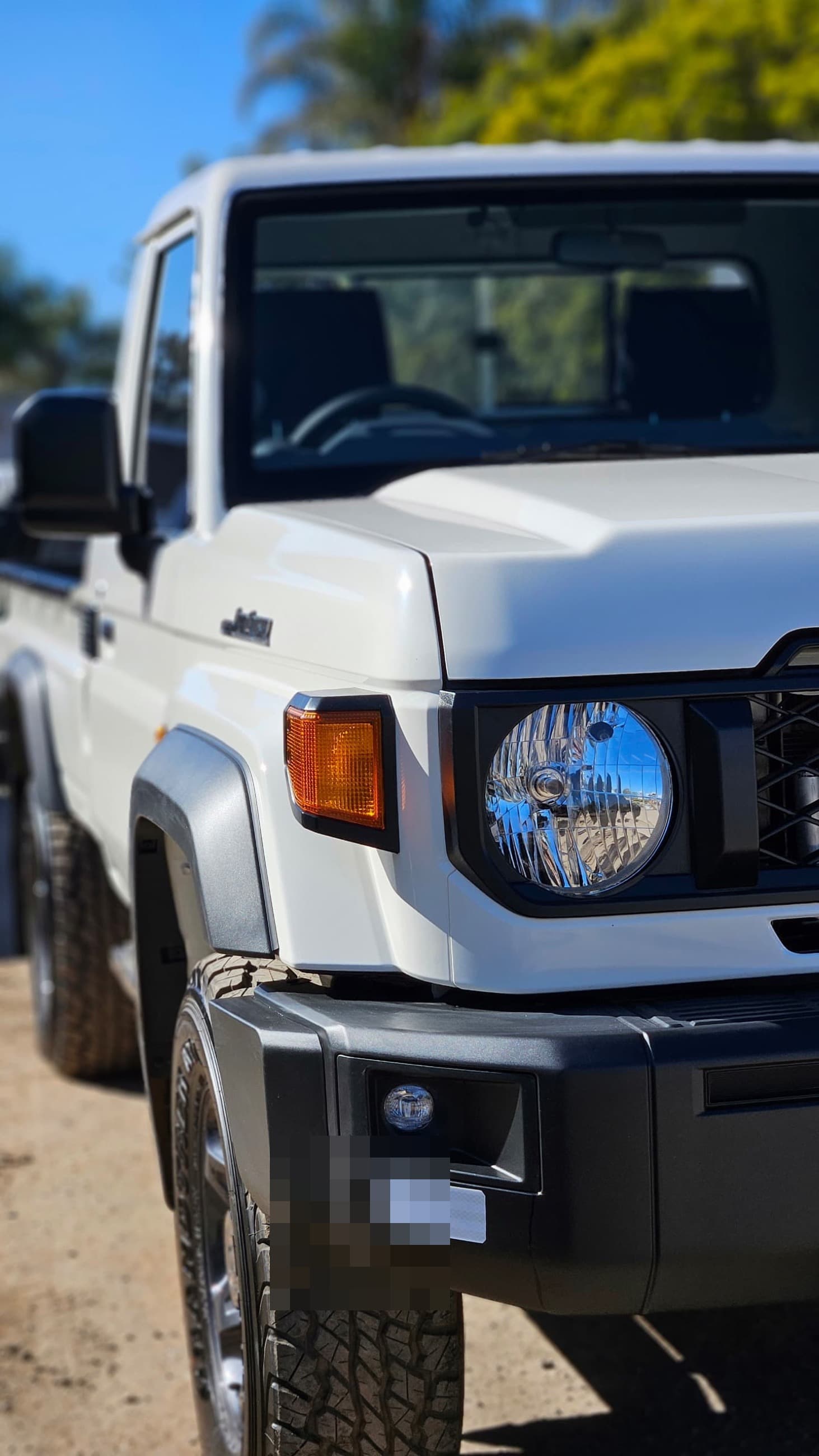 White Toyota Land Cruiser 79 Series rebuilt by Motor Madness, front detail
